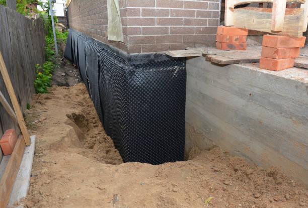 SJ Waterproofing Pros technician performing targeted Sump Pump Installation assessment in McArthur, OH